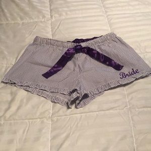 Purple and white striped seersucker shorts.